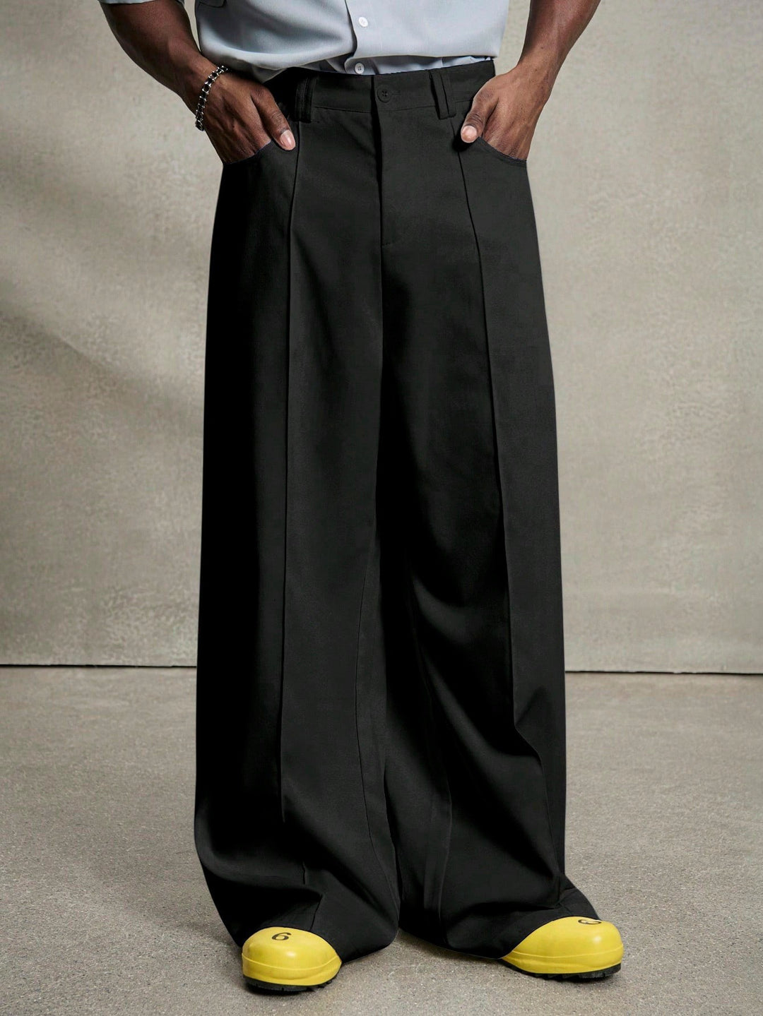 Men's wide pleated pants with high waistband, precise creases, and side inset pockets StylebySassy