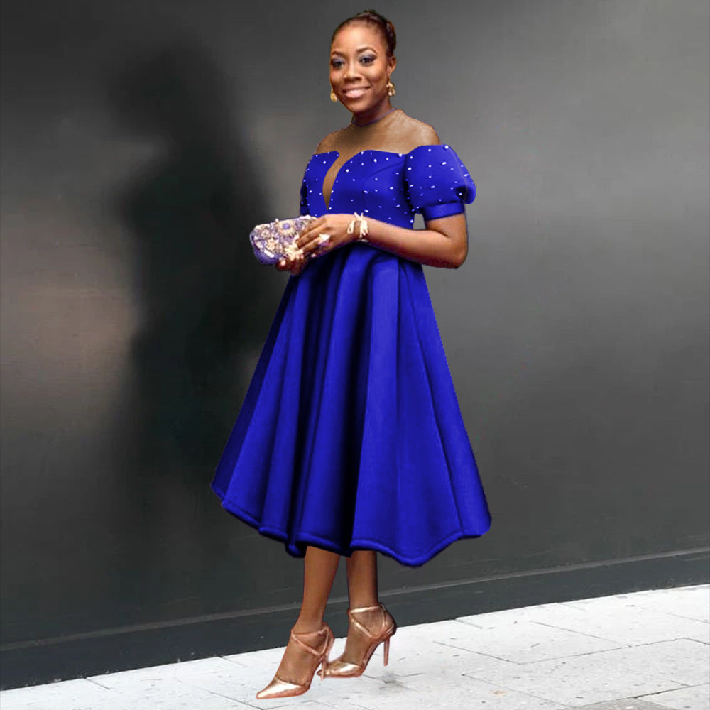 Women's festive midi dress with ruffled sleeves and shimmering accents StylebySassy