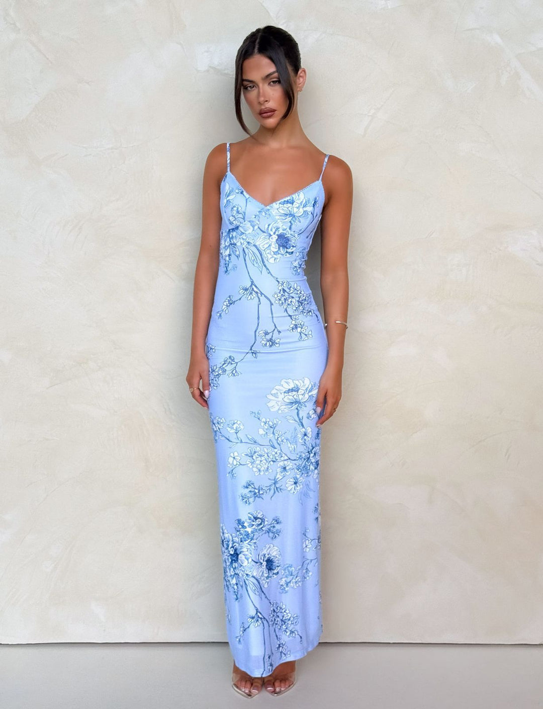Women nan a fitted jersey slip dress with V-neck, spaghetti straps and floral leopard print StylebySassy