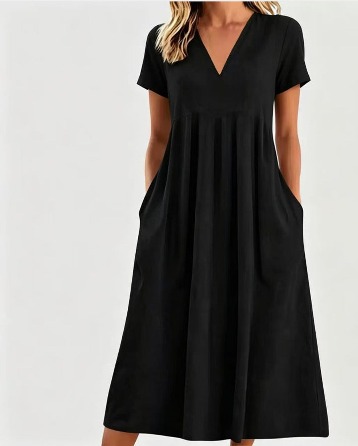 Women nan legeres V-neck midi dress with side pockets and gathered empire seam StylebySassy