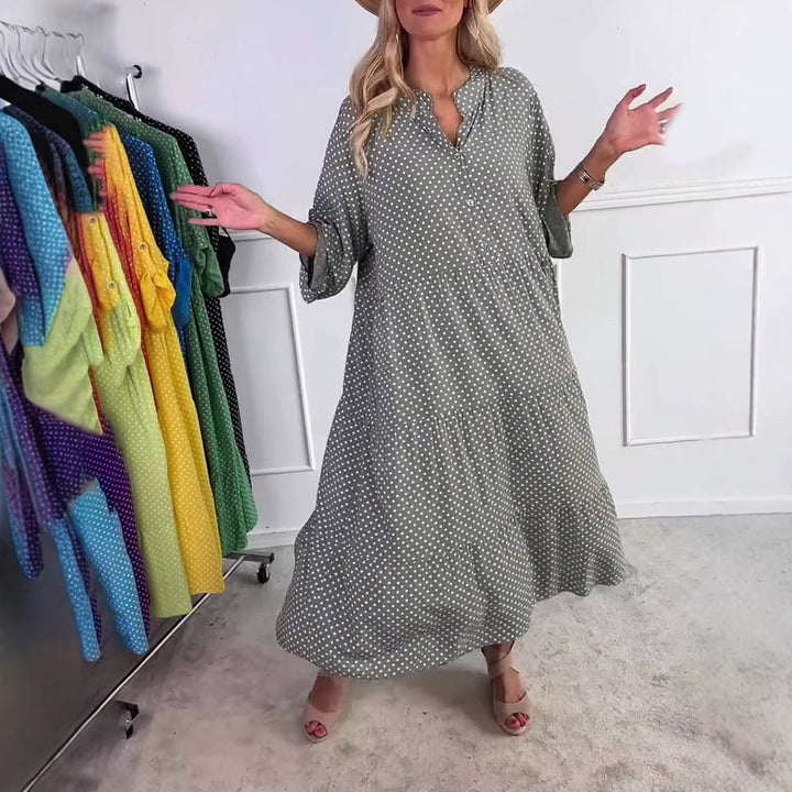 Women's lightweight flowing midi dress with polka dot pattern, tiered skirt and roll-up sleeves StylebySassy