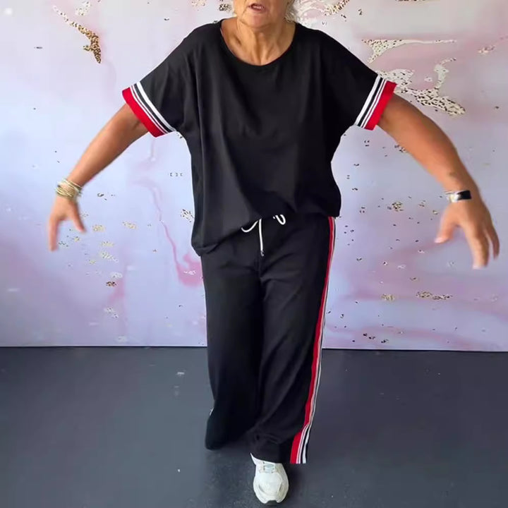 Ladies' sporty-elegant two-piece set with boxy short sleeve shirt, drawstring jog pants, and side contrast stripe StylebySassy