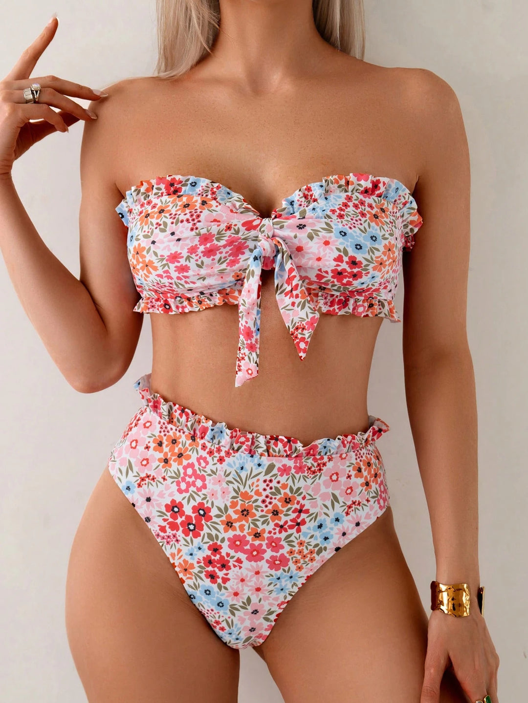 Women's bandeau bikini with playful ruffles and floral pattern StylebySassy