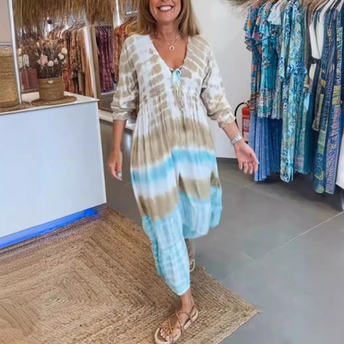 Women's airy batik tiered dress with V-neck, empire waist, and elastic sleeves StylebySassy