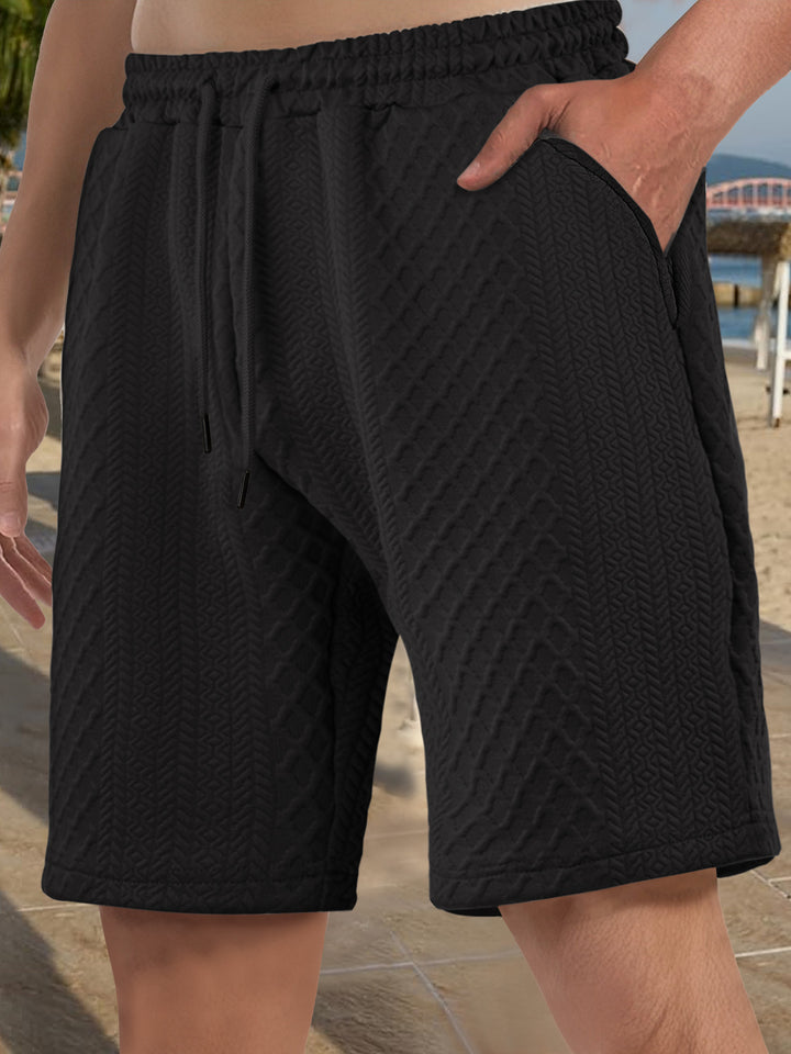 Men's textured beach bermuda shorts made of waffle jersey with elastic drawstring waistband and slanted pockets StylebySassy
