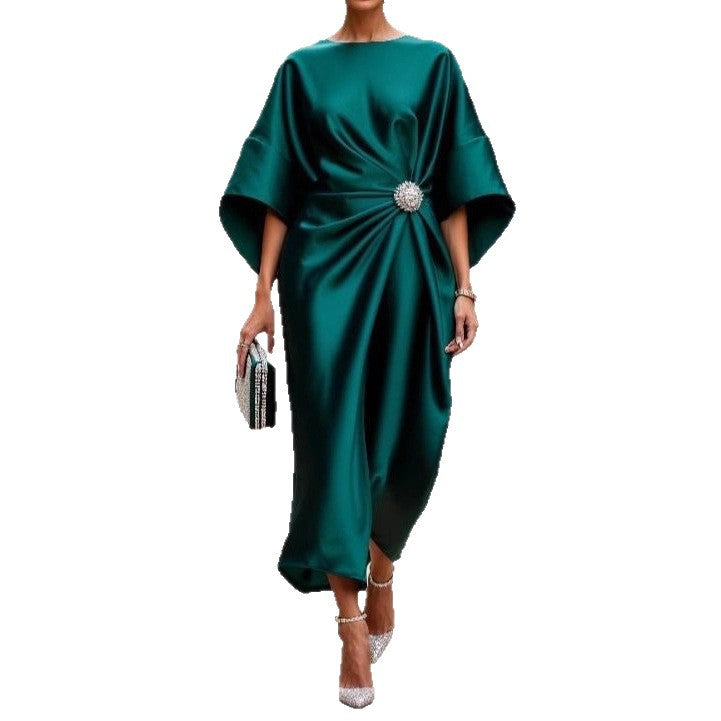Women's elegant satin kaftan midi dress with kimono sleeves, side draping, and decorative brooch StylebySassy