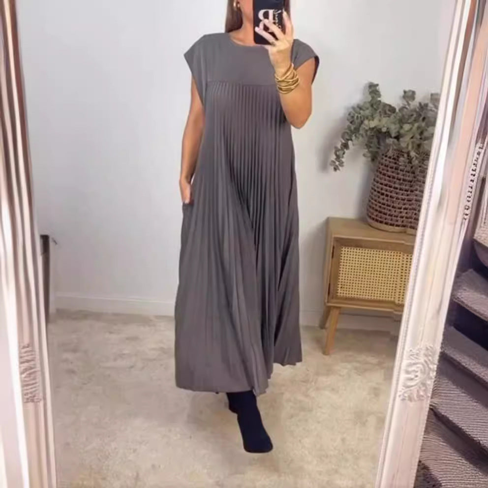 Women's flowing pleated maxi dress with dropped shoulders and side pockets StylebySassy