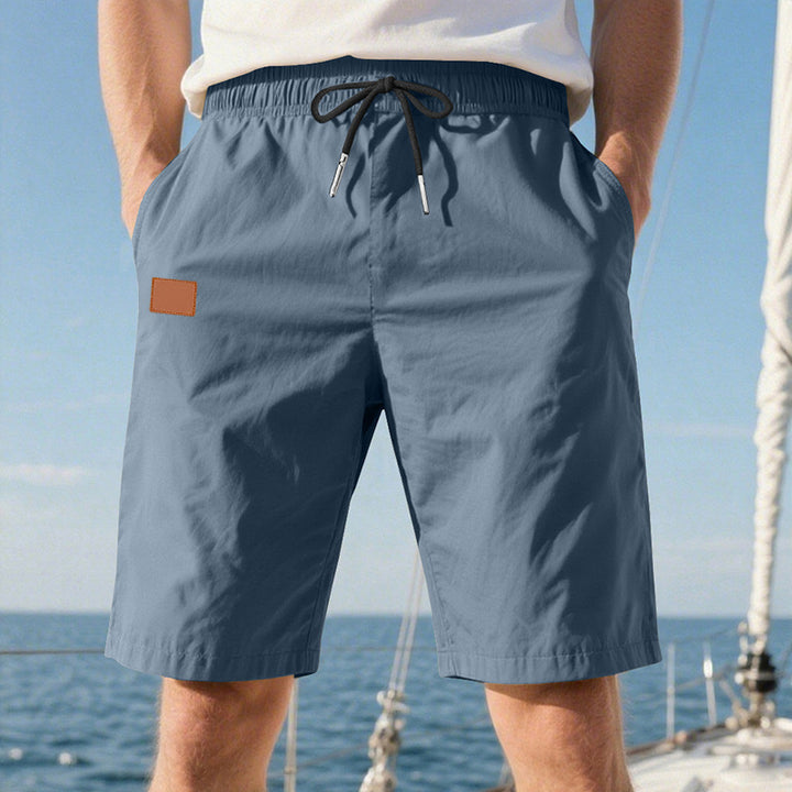 Men's quick-drying swim shorts in Bermuda cut with elastic waistband and drawstring StylebySassy
