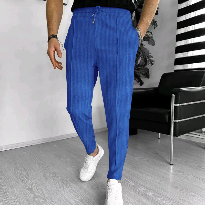 Men's tapered jogging chinos made of structured woven quality with elastic drawstring waistband and decorative crease StylebySassy