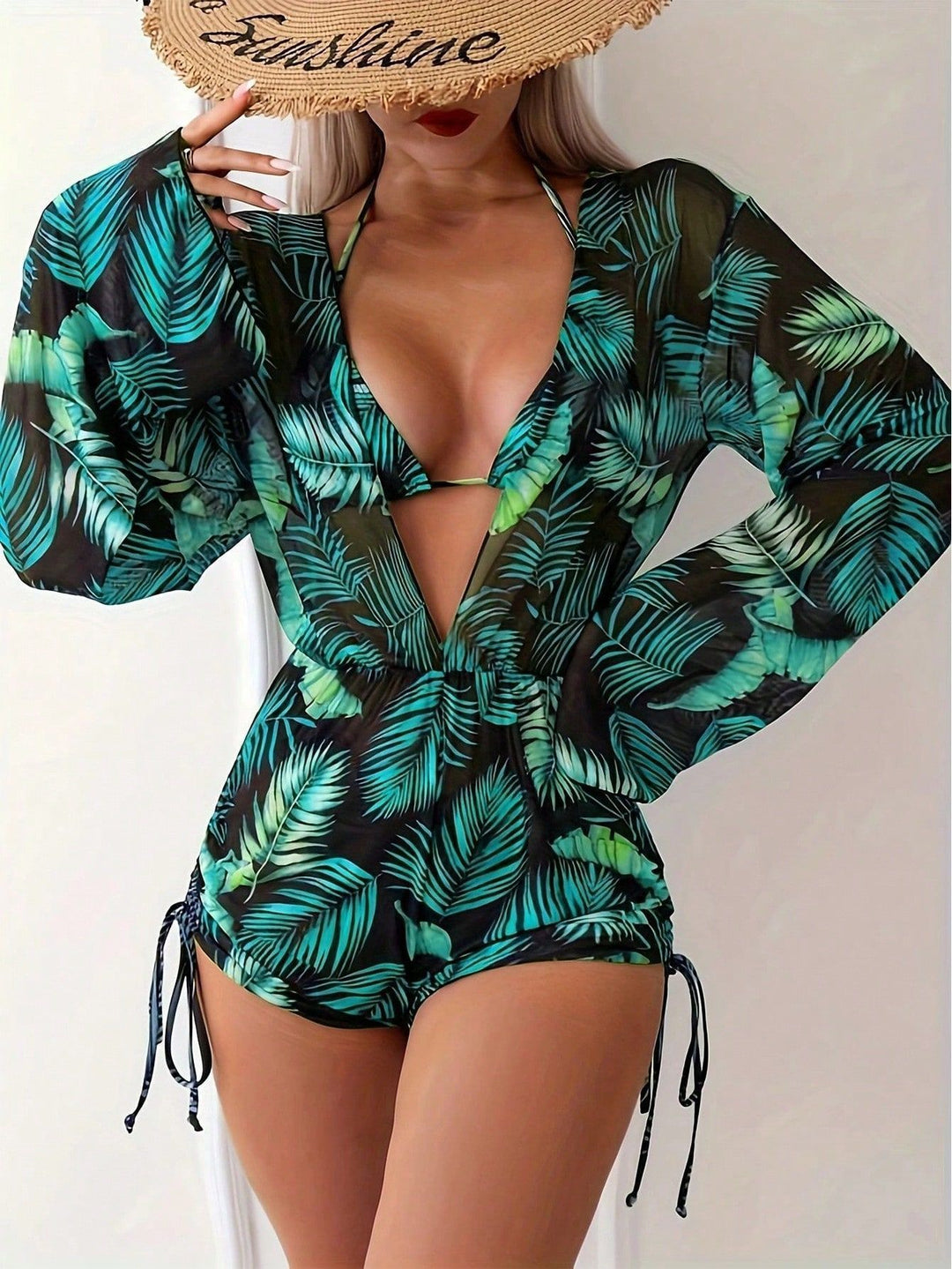 Women's swimsuit with elegant V-neckline and playful palm print StylebySassy
