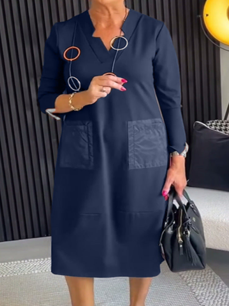 Women's knee-length, loosely falling dress with V-neck contrast pockets made of satin and three-quarter sleeves StylebySassy