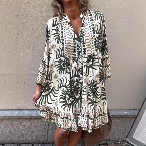 Women's lightweight viscose tunic with buttoned placket, gathered empire waist, elastic sleeve cuffs, and ruffle tiers StylebySassy
