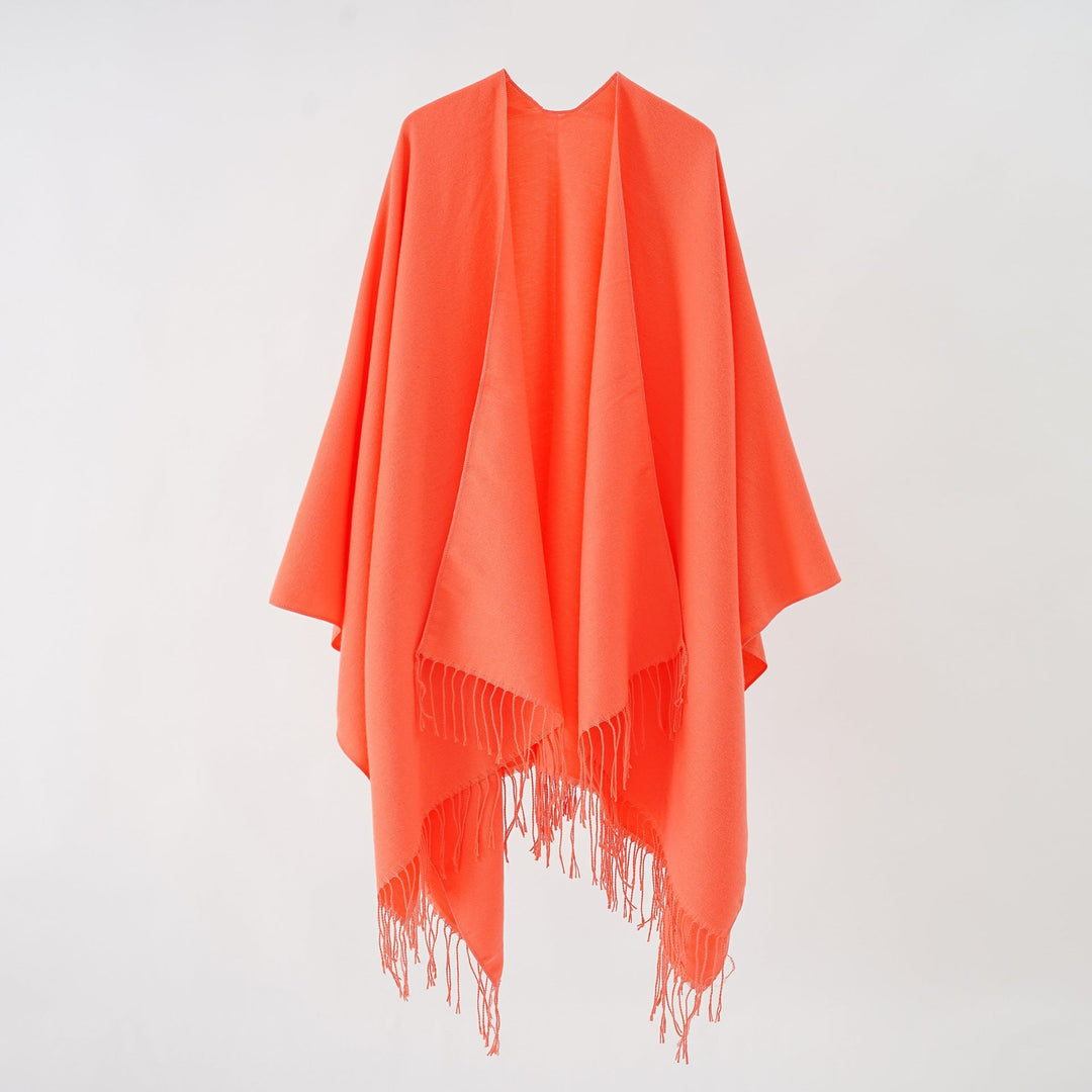 Women's fashionable fringe poncho made of soft material with luxurious drape StylebySassy