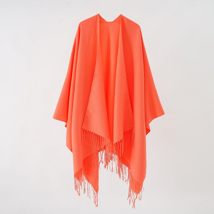Women's fashionable fringe poncho made of soft material with luxurious drape StylebySassy