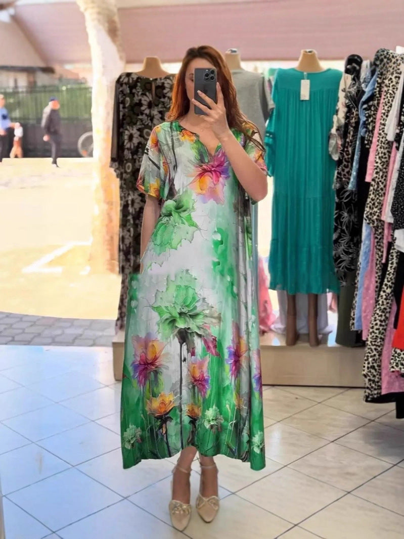 Women flowing maxi kaftan dress with V-neck and large watercolor floral print StylebySassy