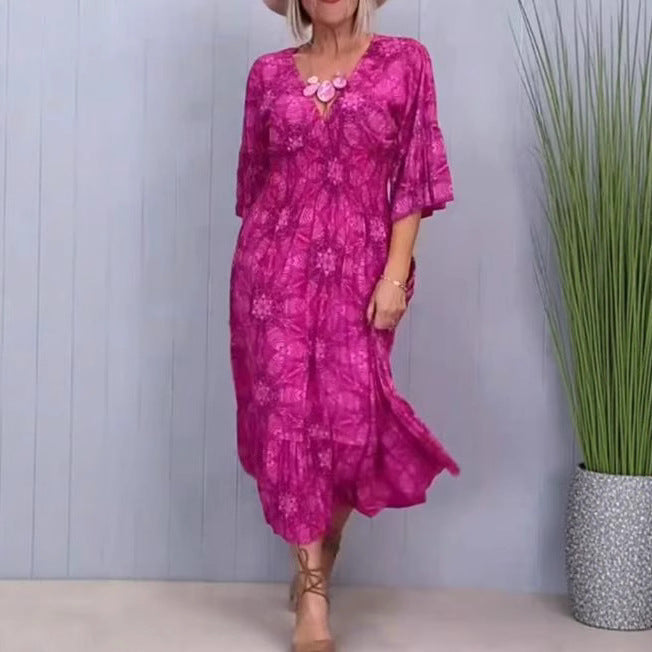 Women's flowing kaftan midi dress with V-neck, loose silhouette, tiered skirt, and three-quarter sleeves StylebySassy