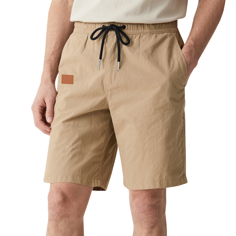 Men's quick-drying swim shorts in Bermuda cut with elastic waistband and drawstring StylebySassy
