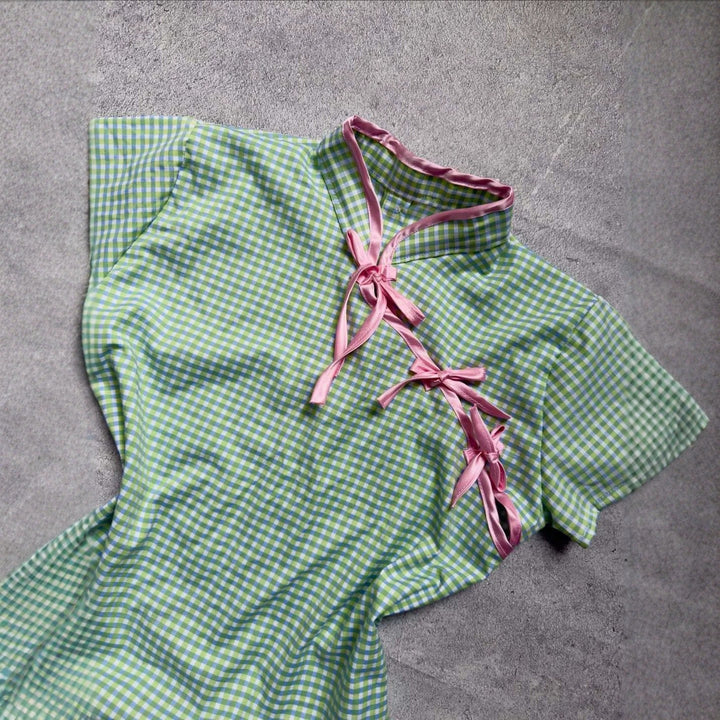 Women’s Chinese short-sleeve shirt with playful check pattern and decorative bows