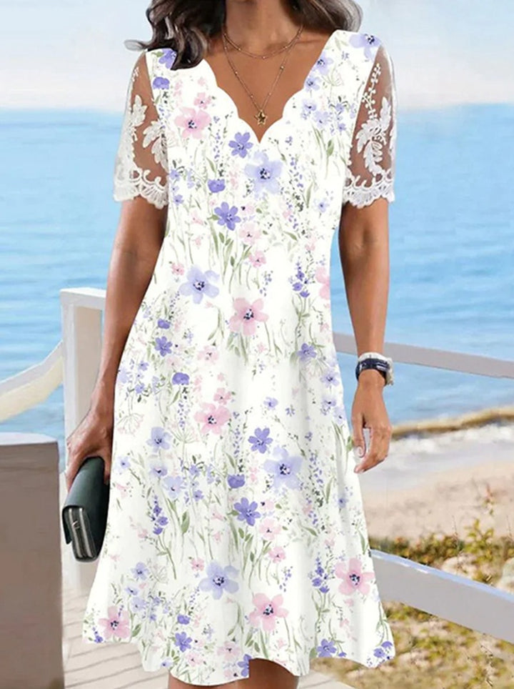 Women's A-line midi dress with wavy V-neck, all-over floral pattern and transparent lace sleeves StylebySassy