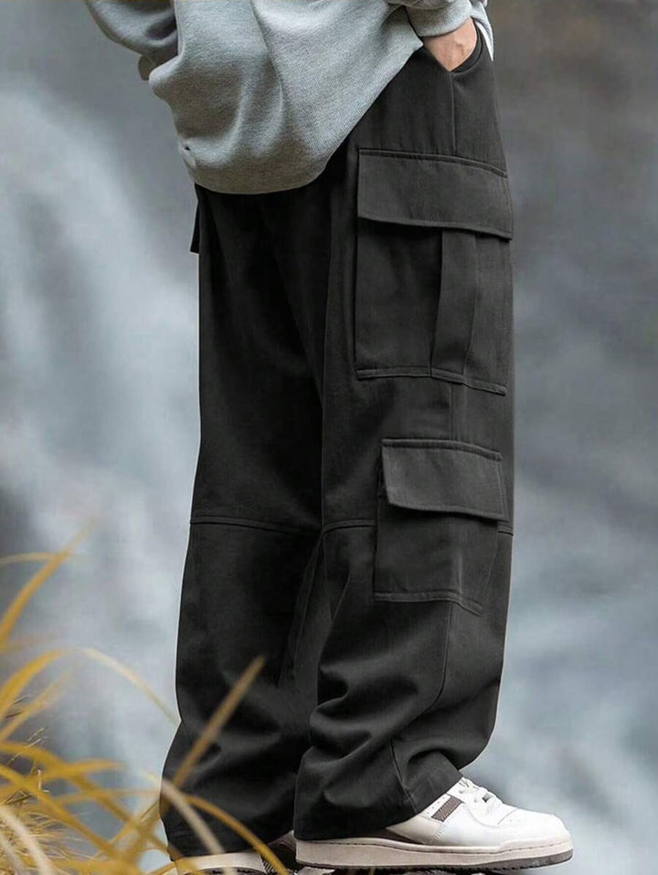 Men's casually cut multiple pockets cargo pants with wide leg and prominent knee darts StylebySassy