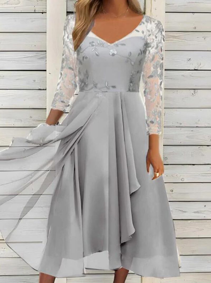 Women's V-neck chiffon midi dress with embroidered bodice, transparent three-quarter sleeves, and asymmetric layered skirt StylebySassy