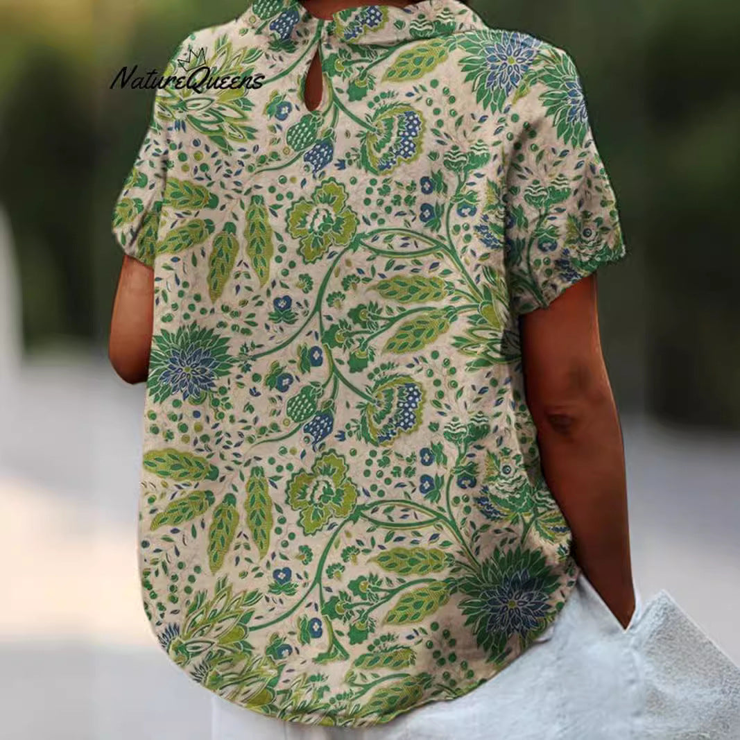 Women's casual short-sleeve blouse with V-neck, rounded hem, and botanical all-over print StylebySassy