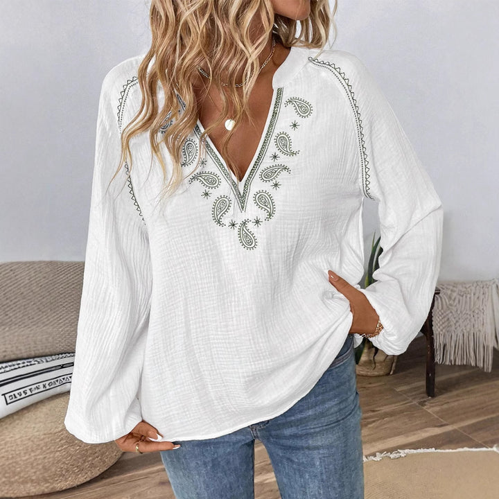 Women's casual cotton gauze blouse with embroidered V-neck, paisley embroidery, raglan seams, and wide balloon sleeves StylebySassy