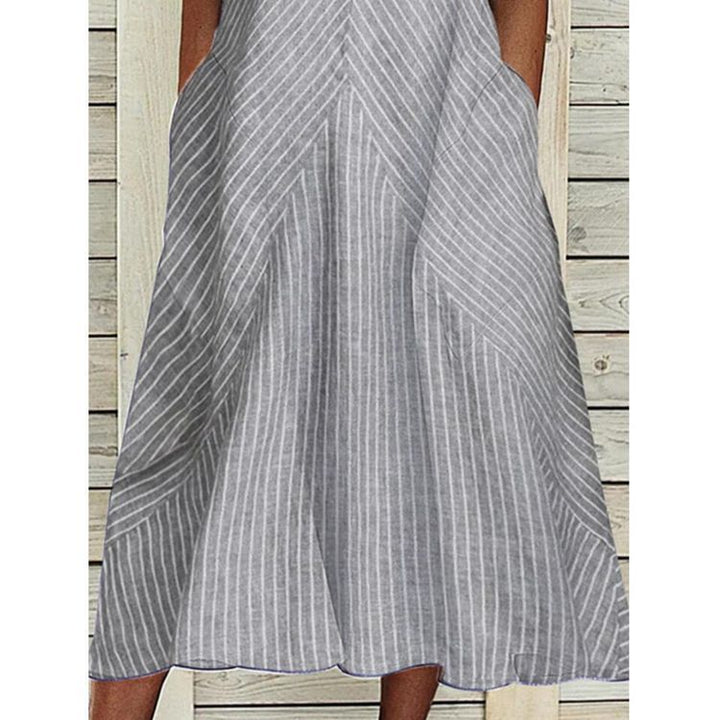 Women’s sleeveless A-line midi dress with ruffle V-neck, diagonal striped linen look and side pockets StylebySassy