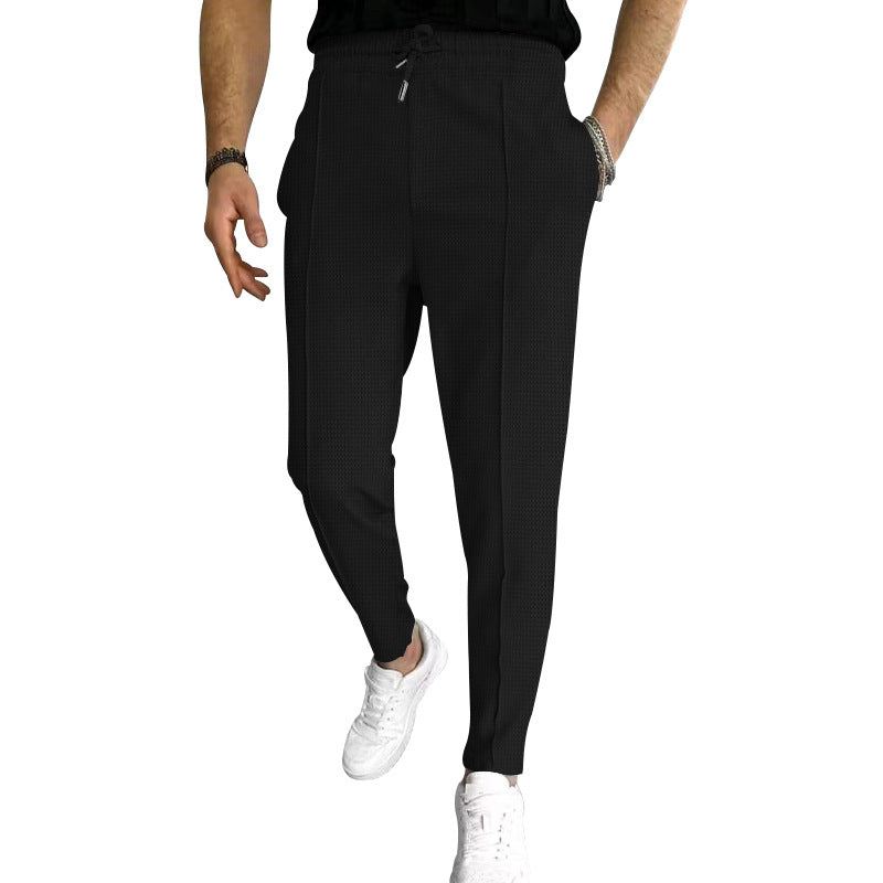 Men's tapered jogging chinos made of structured woven quality with elastic drawstring waistband and decorative crease StylebySassy
