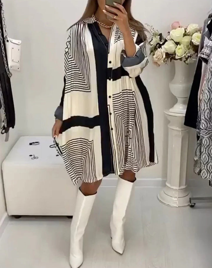 Women's knee-length A-line shirt dress with graphic line print, concealed button placket, and oversized cuffs StylebySassy