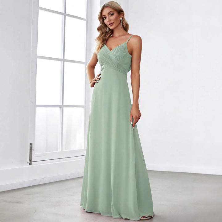 Ladies flowing chiffon evening dress with crossed draping, empire waist and fine spaghetti straps StylebySassy