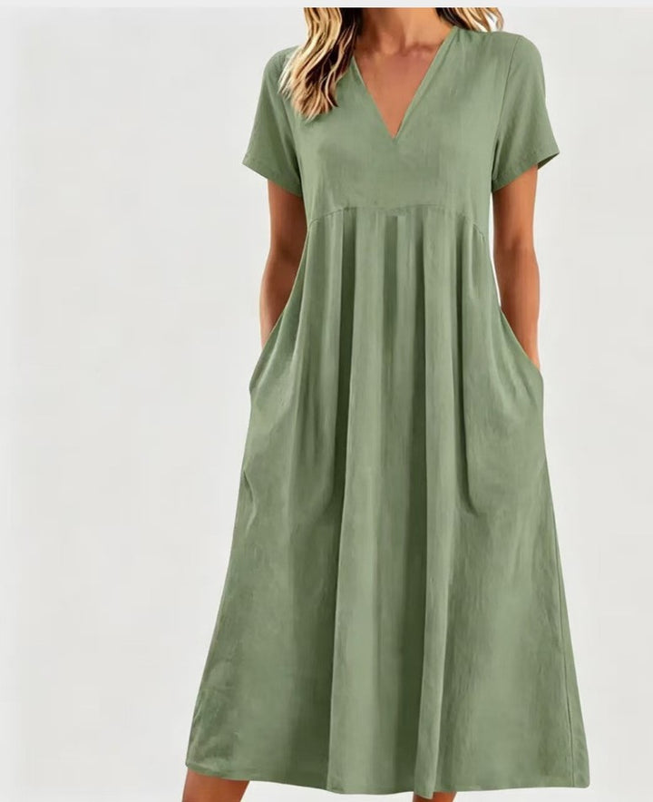 Women nan legeres V-neck midi dress with side pockets and gathered empire seam StylebySassy
