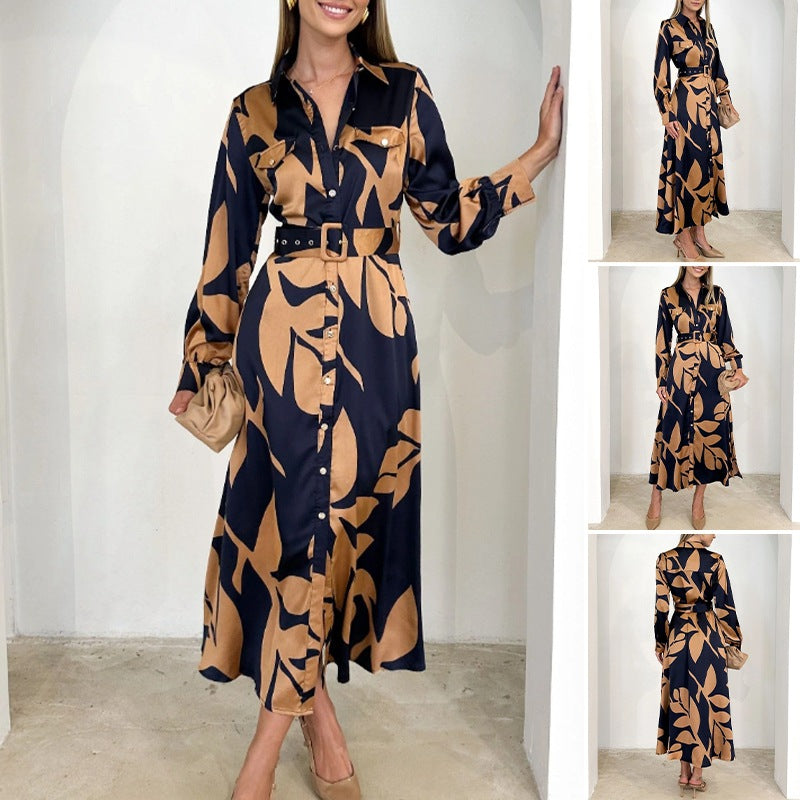 Ladies' elegant satin shirt dress with waist belt, chest pockets, and abstract leaf print StylebySassy