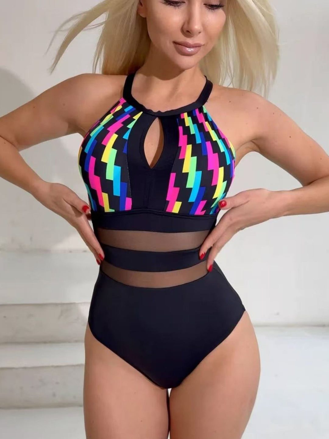 Women’s sporty swimsuit with fashionable mesh inserts StylebySassy