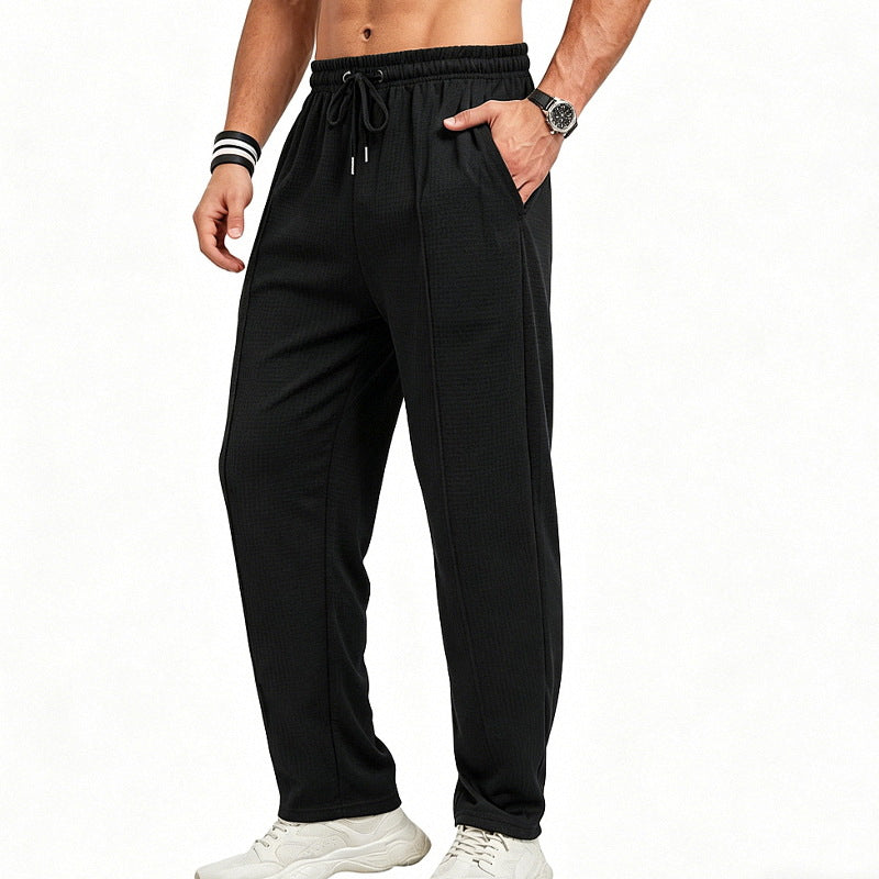 Men's straight-cut relaxed trousers with decorative center seam, elasticated drawstring waistband and side pockets StylebySassy