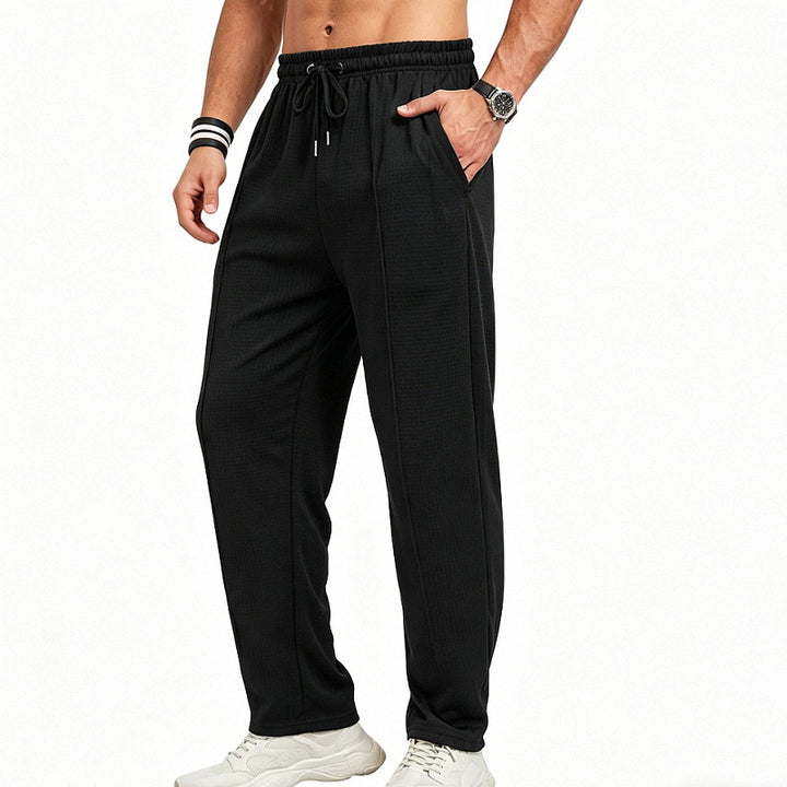 Men's straight-cut relaxed trousers with decorative center seam, elasticated drawstring waistband and side pockets StylebySassy