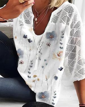 Women's V-neck tunic with lace-knit sleeves and subtle watercolor floral print StylebySassy