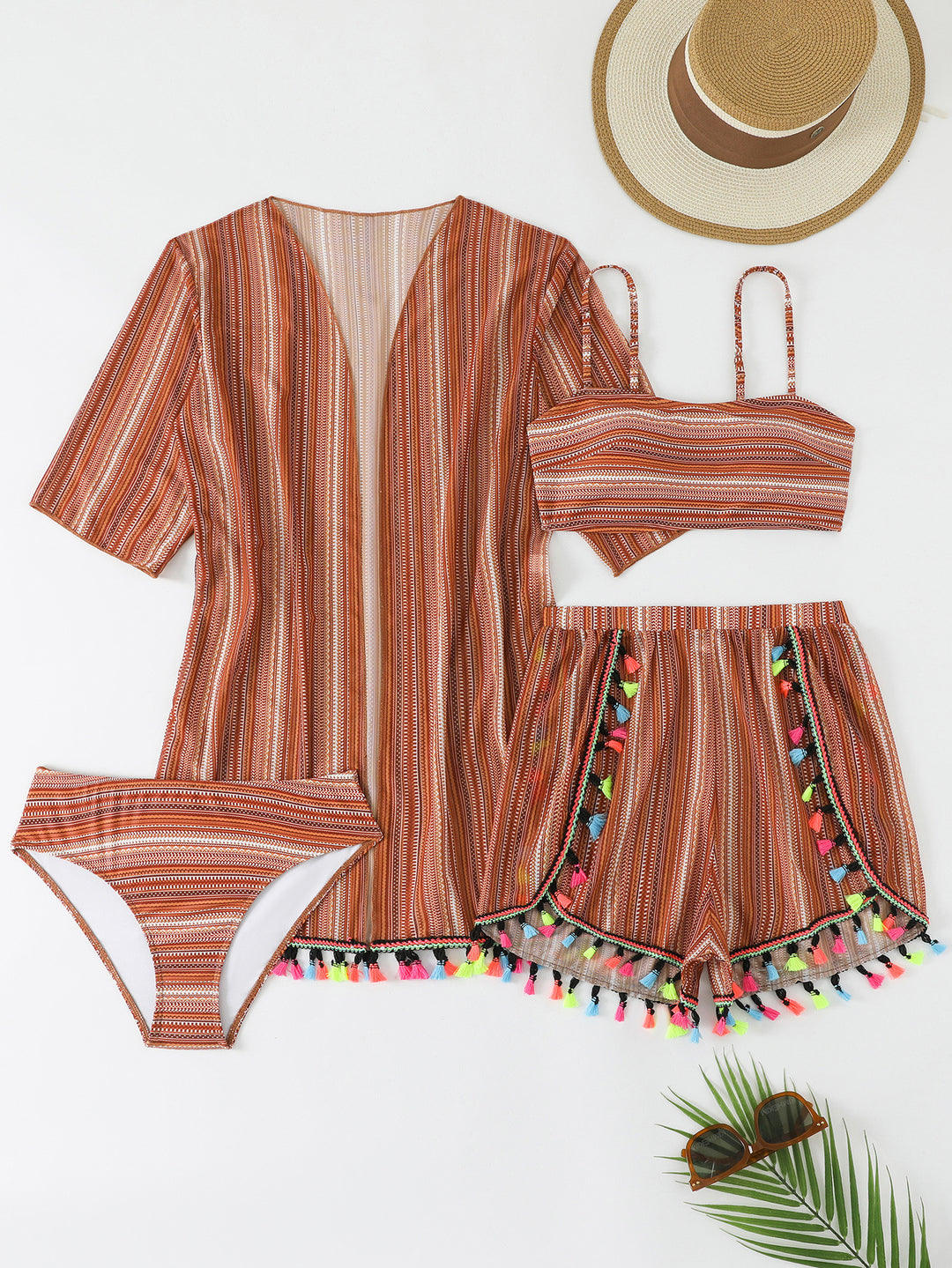 Women's bikini set with colorful wrap skirt and playful pom poms StylebySassy