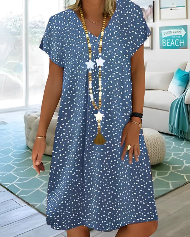 Ladies nan locker falling V-neck short dress with A-line cut, cap sleeves and all-over heart print StylebySassy