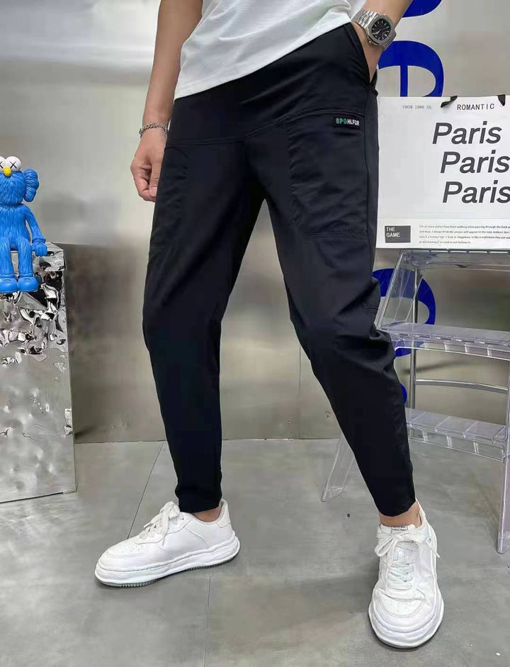 Men's sporty cargo jogger pants with elastic waistband, drawstring, and tapered leg hem StylebySassy