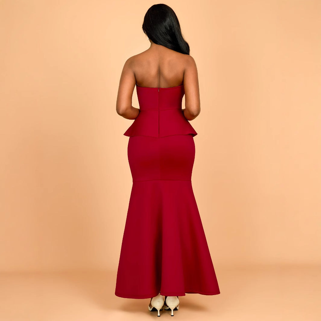 Women's evening dress with shimmering details and voluminous peplum drape
