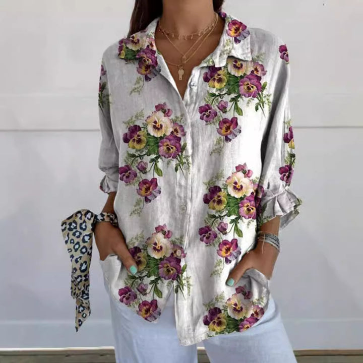 Women's lightweight linen-look shirt blouse with floral pattern, loose fit, roll-up sleeves, and patch pockets StylebySassy