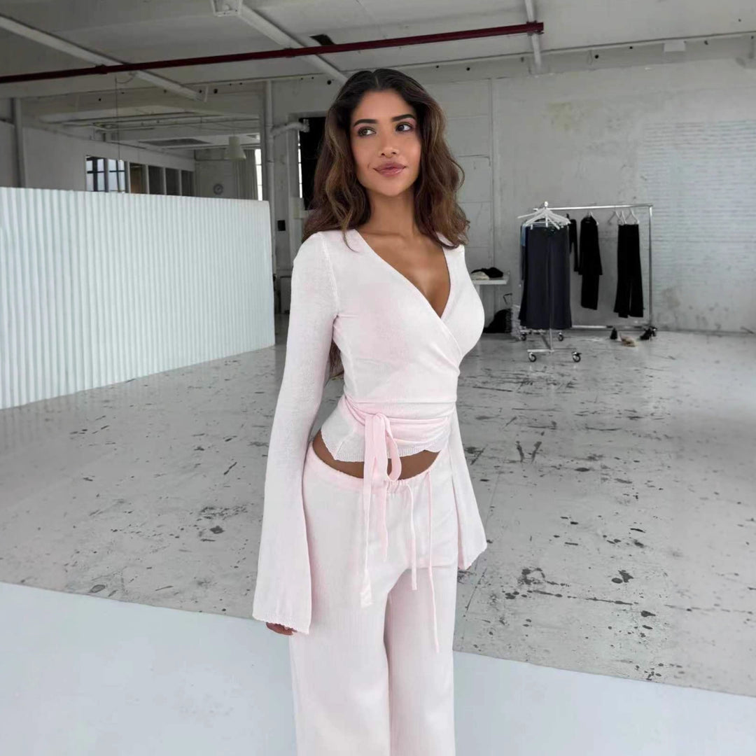 Women's knitted wrap top with tie belt and trumpet sleeves, as well as high-waisted wide-cut knitted pants StylebySassy