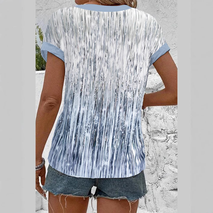 Women's short sleeve blouse with vertical brushstroke print, contrasting button placket and loose hem StylebySassy