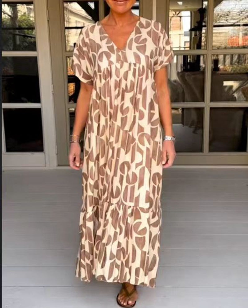 Women's voluminous maxi dress with under-bust seam, V-neck, short kimono sleeves, and tiered ruffle StylebySassy