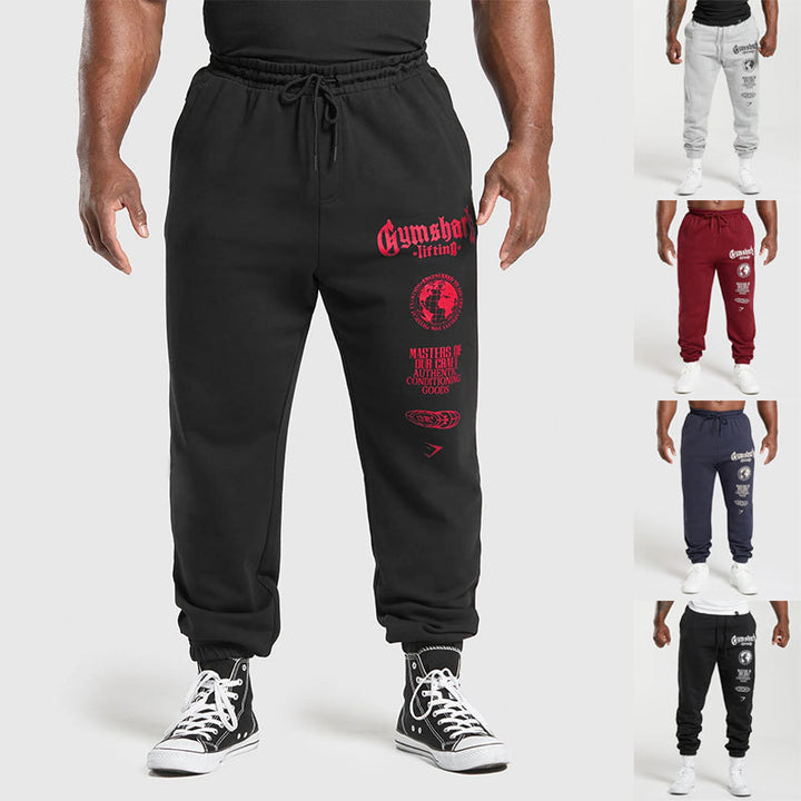 Men's tapered cotton fleece sweatpants with an elastic drawstring waistband, ribbed leg openings, and large logo print StylebySassy