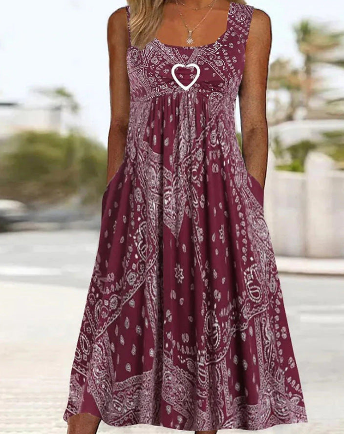 Women's airy maxi dress with paisley bandana print, gathered empire waist and practical side pockets StylebySassy