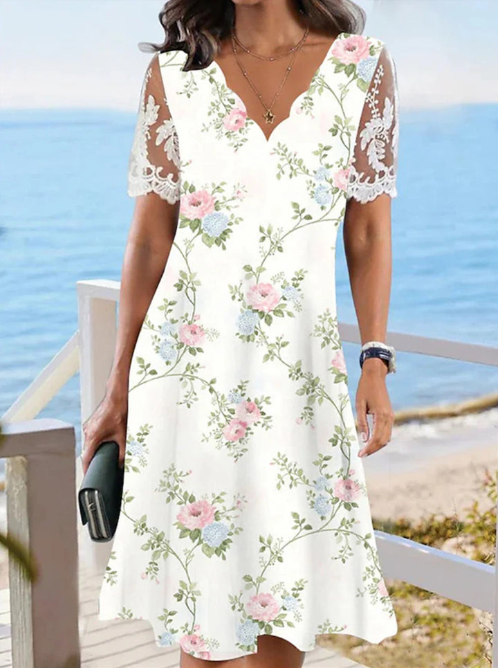 Women's A-line midi dress with wavy V-neck, all-over floral pattern and transparent lace sleeves StylebySassy