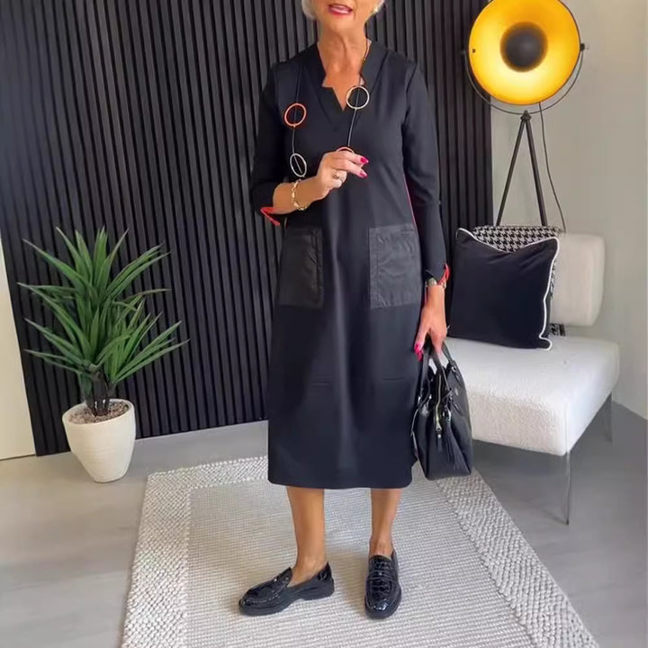 Women's knee-length, loosely falling dress with V-neck contrast pockets made of satin and three-quarter sleeves StylebySassy