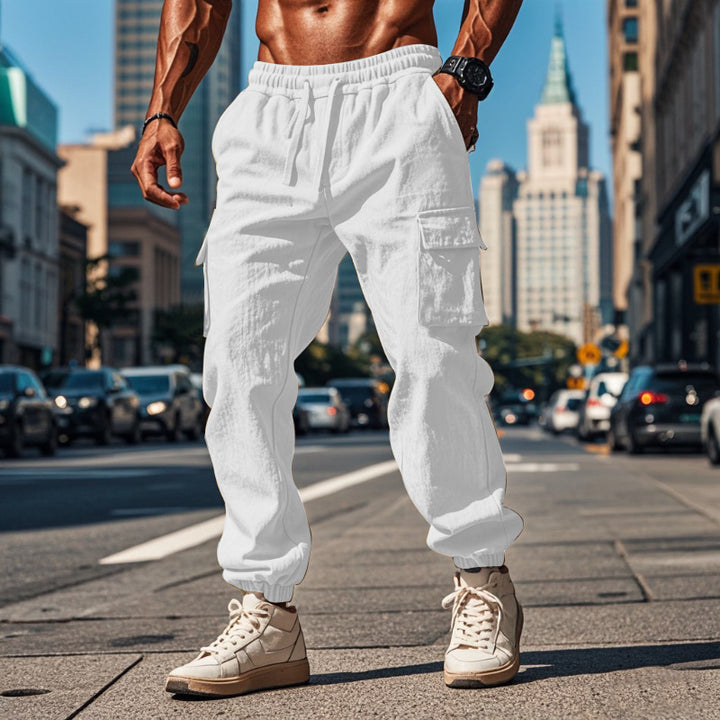 Men's sporty work-inspired joggers with patch flap pockets, elastic drawstring waistband, and gathered leg cuffs StylebySassy